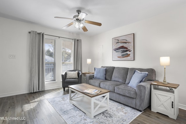 living room featuring ceiling fan and hardwood / wood-style floors