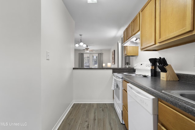 kitchen featuring white appliances, ceiling fan, decorative light fixtures, and dark hardwood / wood-style floors