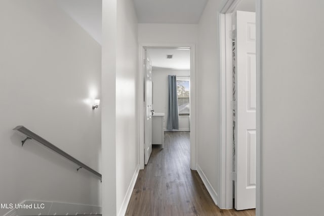 corridor featuring hardwood / wood-style floors