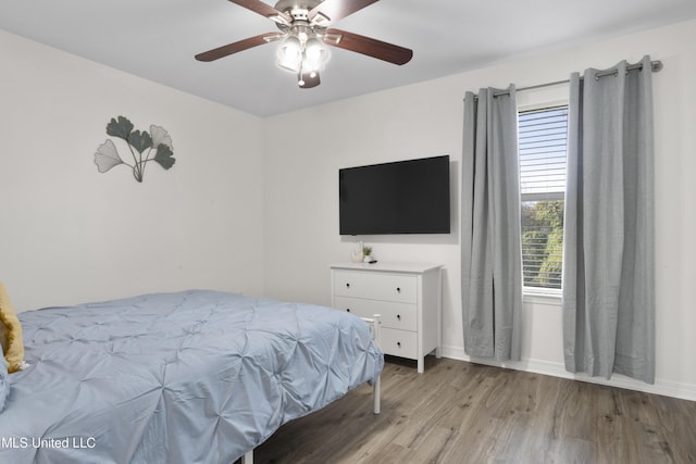 bedroom featuring ceiling fan and light wood-type flooring