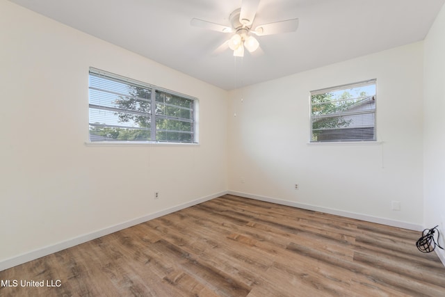 205 Walnut Dr, Ocean Springs, MS 39564 - unfurnished room featuring healthy amount of natural light, wood finished floors, and ceiling fan