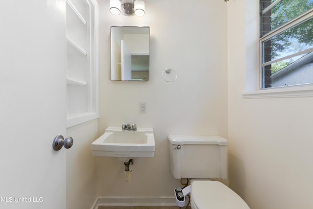 205 Walnut Dr, Ocean Springs, MS 39564 - bathroom featuring toilet and baseboards