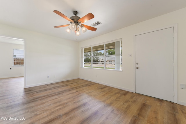 205 Walnut Dr, Ocean Springs, MS 39564 - unfurnished room featuring plenty of natural light, ceiling fan, and wood finished floors