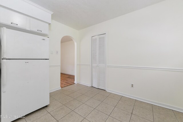 205 Walnut Dr, Ocean Springs, MS 39564 - spare room featuring arched walkways and light tile patterned flooring