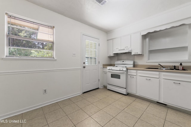 205 Walnut Dr, Ocean Springs, MS 39564 - kitchen featuring white range with gas cooktop, under cabinet range hood, white cabinetry, light countertops, and light tile patterned flooring