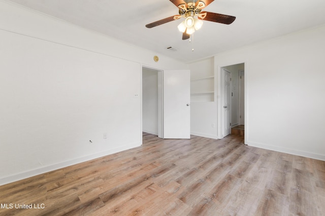 205 Walnut Dr, Ocean Springs, MS 39564 - unfurnished bedroom featuring wood finished floors and ceiling fan