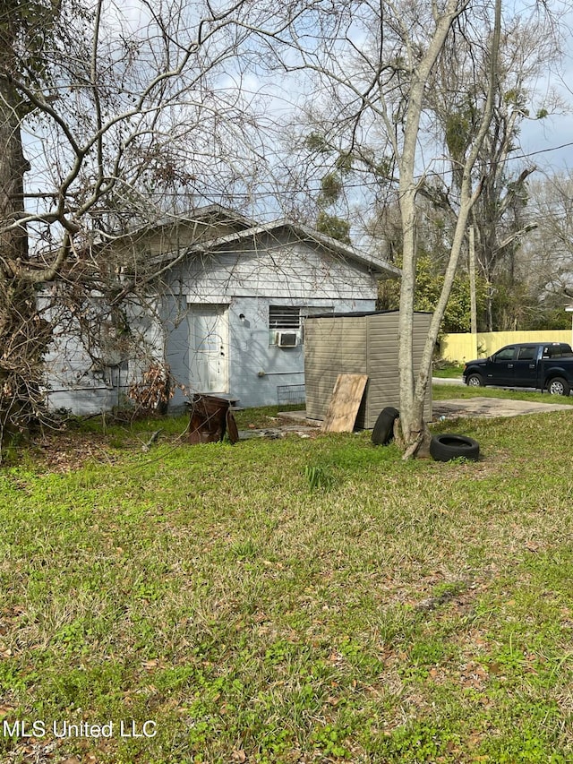 view of side of home featuring a lawn