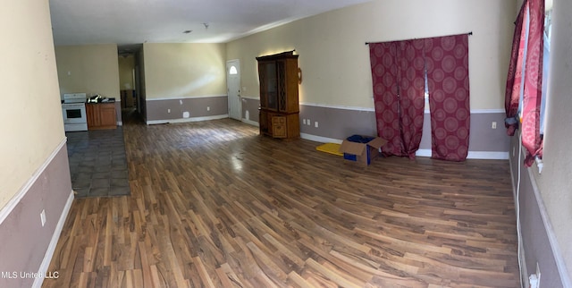 empty room featuring dark hardwood / wood-style flooring