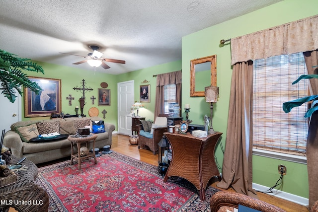 1825 Brookhaven Dr, Southaven, MS 38671 - living area with plenty of natural light, ceiling fan, wood finished floors, and a textured ceiling