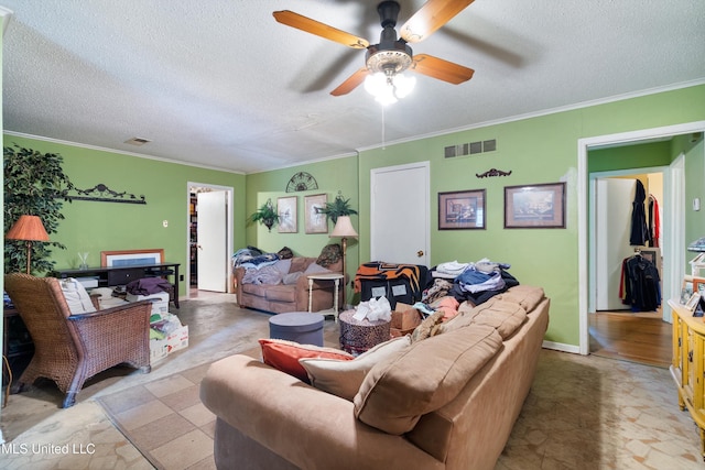 1825 Brookhaven Dr, Southaven, MS 38671 - living room featuring ceiling fan, a textured ceiling, and crown molding