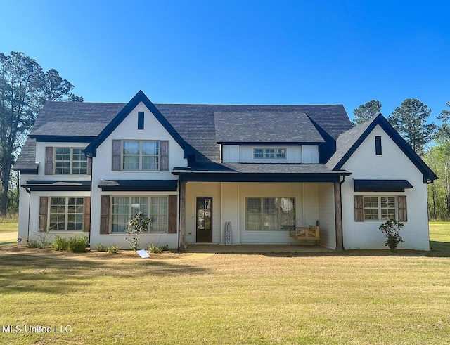 481 Poplar Ln, Holly Springs, MS 38635 - view of front of house with a porch, roof with shingles, and a front lawn