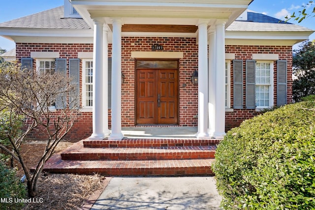 property entrance with covered porch