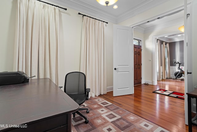 home office featuring hardwood / wood-style floors and crown molding