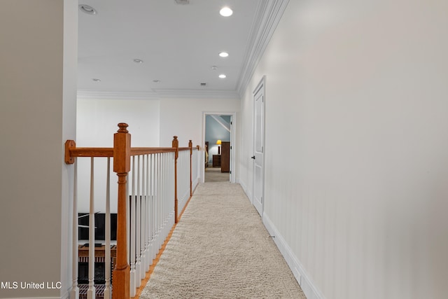 hall featuring light colored carpet and ornamental molding