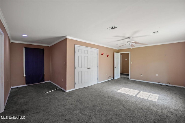 unfurnished bedroom featuring baseboards, crown molding, carpet flooring, and visible vents