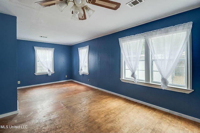 spare room featuring ceiling fan and hardwood / wood-style floors