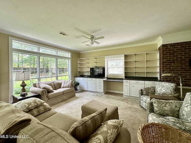 living room featuring crown molding, ceiling fan, visible vents, and light carpet