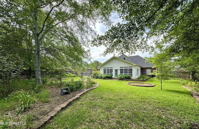 view of yard featuring a fenced backyard