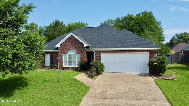 ranch-style home with a garage, fence, roof with shingles, brick siding, and concrete driveway