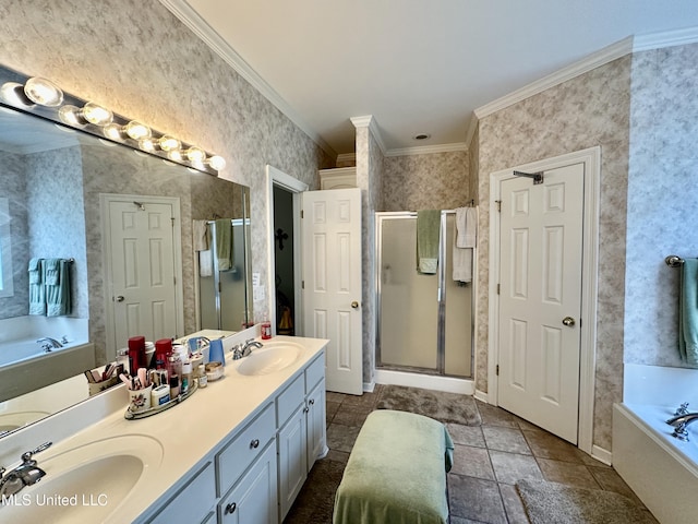 full bath featuring a sink, crown molding, a shower stall, and a bath
