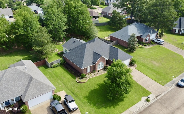birds eye view of property with a residential view
