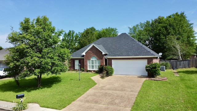 ranch-style home featuring a garage, a front lawn, fence, brick siding, and driveway