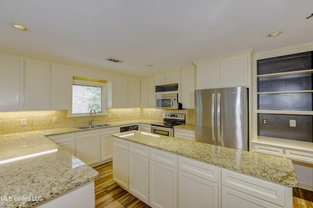 3099 E Fairway Dr, Brandon, MS 39047 - kitchen with appliances with stainless steel finishes, a sink, light stone counters, decorative backsplash, and recessed lighting