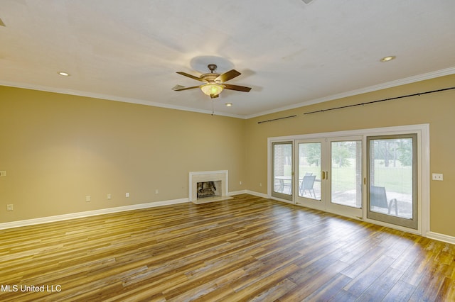 3099 E Fairway Dr, Brandon, MS 39047 - spare room featuring wood finished floors, baseboards, ceiling fan, recessed lighting, and a fireplace with flush hearth