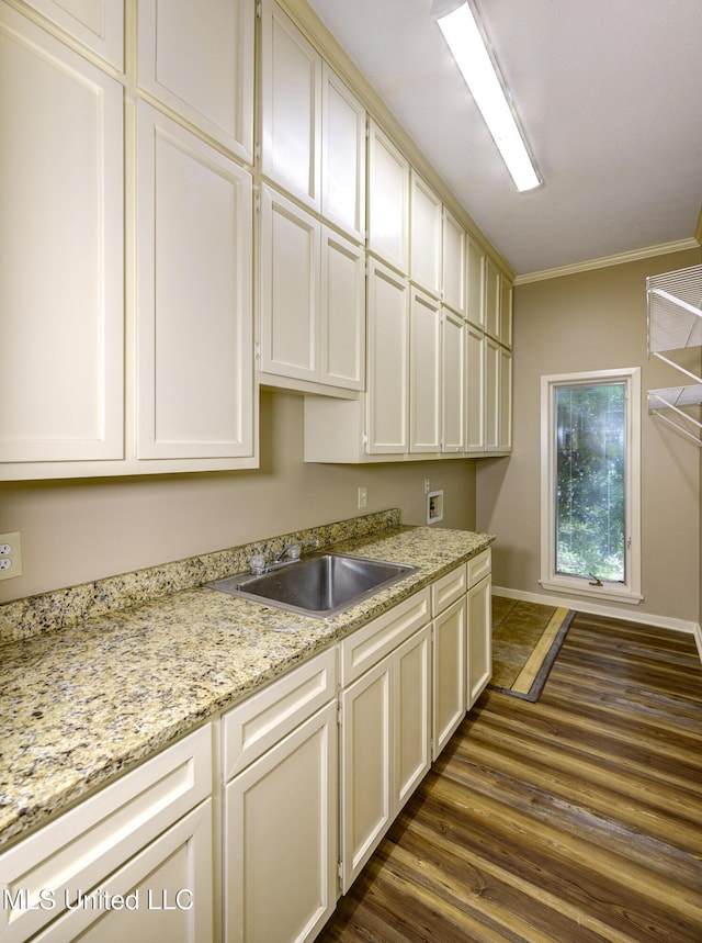 3099 E Fairway Dr, Brandon, MS 39047 - laundry room with cabinet space, hookup for a washing machine, ornamental molding, dark wood finished floors, and baseboards