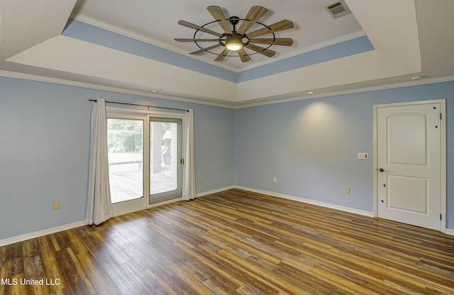 3099 E Fairway Dr, Brandon, MS 39047 - empty room featuring a raised ceiling, wood finished floors, ceiling fan, baseboards, and ornamental molding