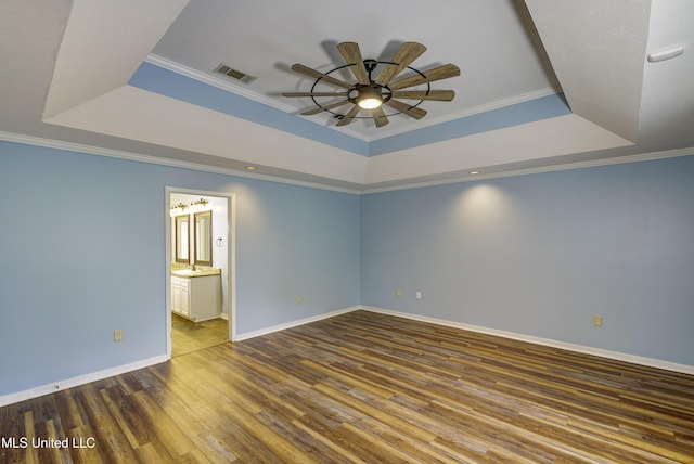 3099 E Fairway Dr, Brandon, MS 39047 - empty room featuring a raised ceiling, ceiling fan, wood finished floors, baseboards, and crown molding