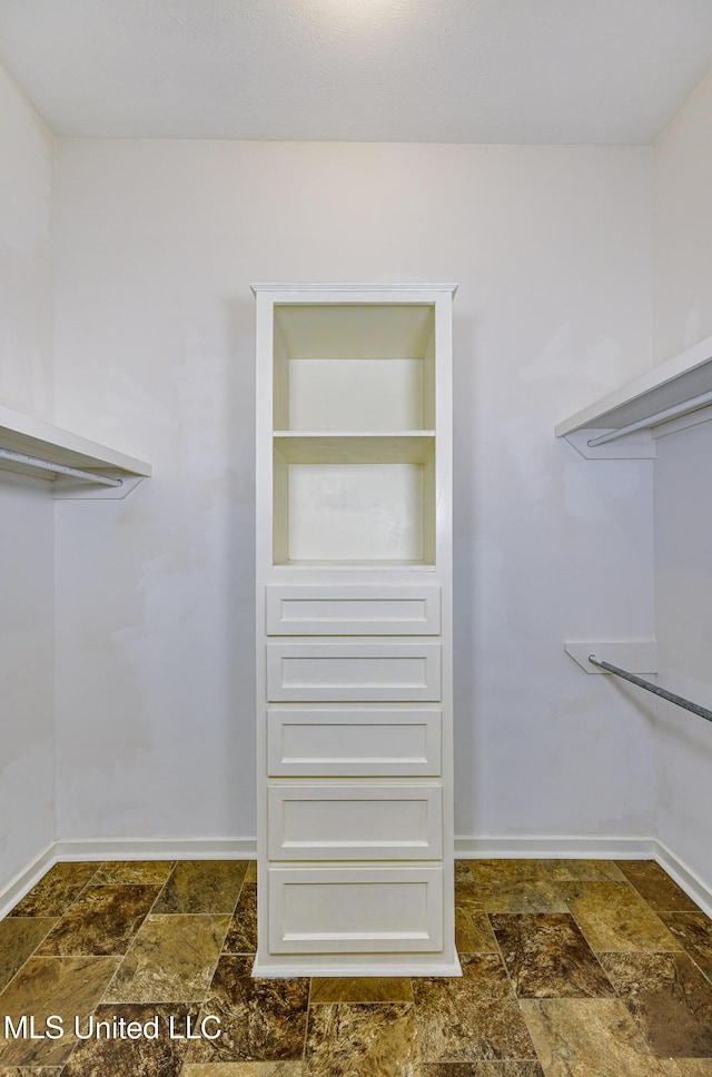 3099 E Fairway Dr, Brandon, MS 39047 - walk in closet with stone tile flooring