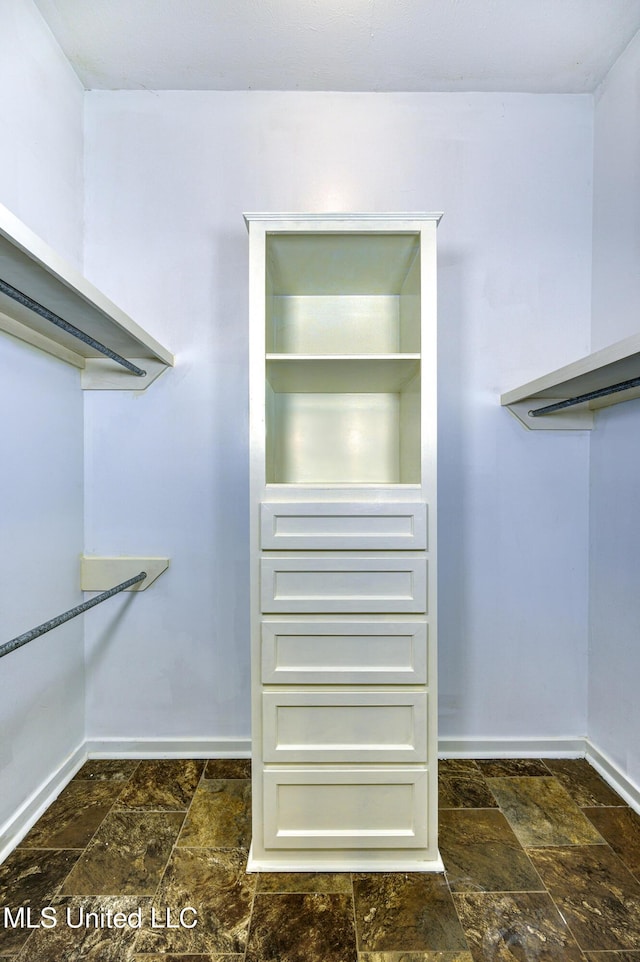 3099 E Fairway Dr, Brandon, MS 39047 - spacious closet featuring stone tile flooring