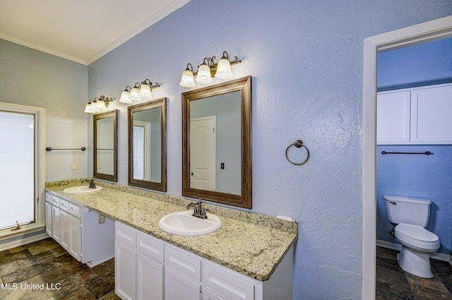 3099 E Fairway Dr, Brandon, MS 39047 - full bathroom featuring stone finish floors, crown molding, toilet, and double vanity