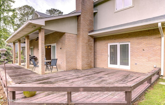3099 E Fairway Dr, Brandon, MS 39047 - wooden deck with outdoor dining area