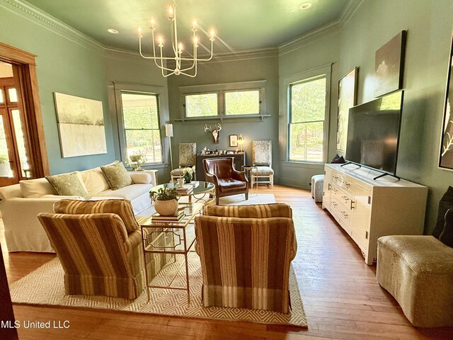 101 E E President, Greenwood, MS 38930 - living area with a chandelier, light wood-type flooring, and ornamental molding