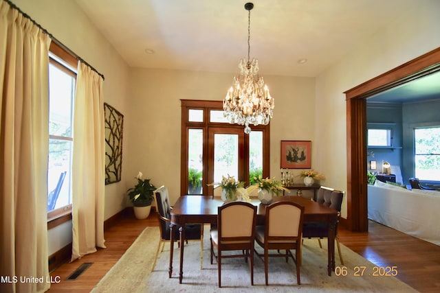 101 E E President, Greenwood, MS 38930 - dining area with a chandelier and wood finished floors
