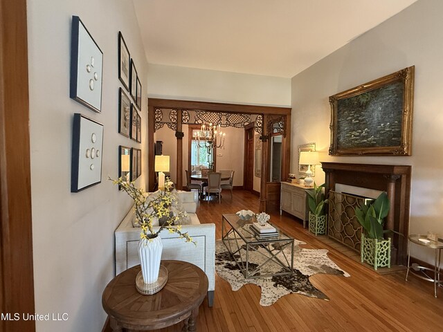 101 E E President, Greenwood, MS 38930 - living room featuring a chandelier and wood finished floors
