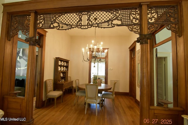 101 E E President, Greenwood, MS 38930 - dining area with a chandelier and wood finished floors