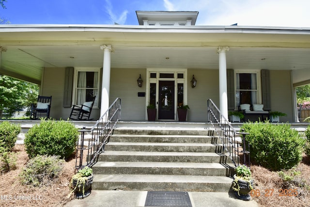 101 E E President, Greenwood, MS 38930 - doorway to property featuring a porch