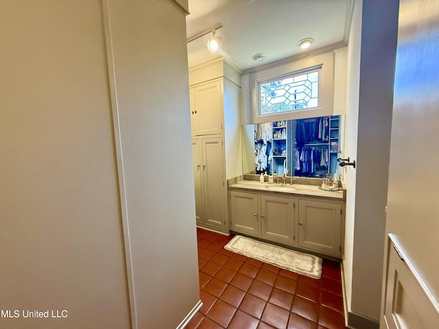 101 E E President, Greenwood, MS 38930 - bathroom with tile patterned floors, vanity, and crown molding