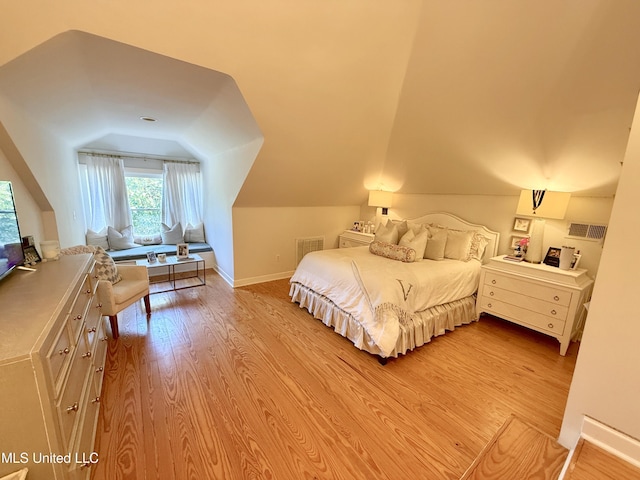 101 E E President, Greenwood, MS 38930 - bedroom featuring lofted ceiling and light wood-style floors