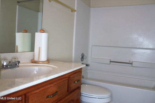 bathroom with vanity, toilet, and shower / bathtub combination
