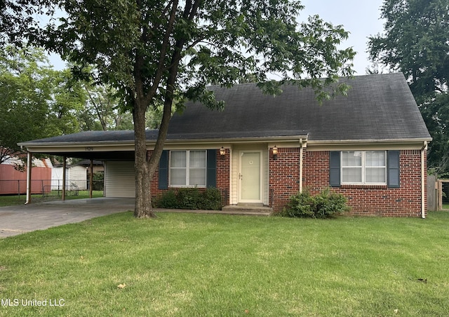 1529 Ticonderoga Dr, Southaven, MS 38671 - view of front of house with concrete driveway, a carport, and brick siding