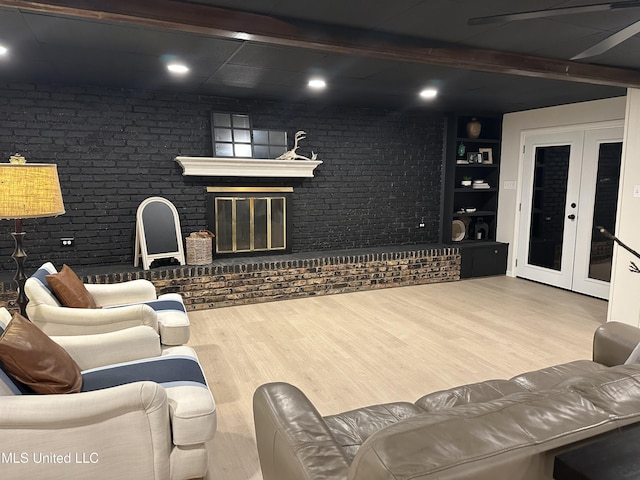 1529 Ticonderoga Dr, Southaven, MS 38671 - living room with wood finished floors, french doors, brick wall, and beamed ceiling