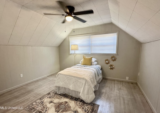 1529 Ticonderoga Dr, Southaven, MS 38671 - bedroom featuring wood finished floors, baseboards, vaulted ceiling, and a ceiling fan