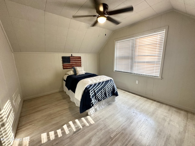 1529 Ticonderoga Dr, Southaven, MS 38671 - bedroom with wood finished floors, lofted ceiling, baseboards, and a ceiling fan