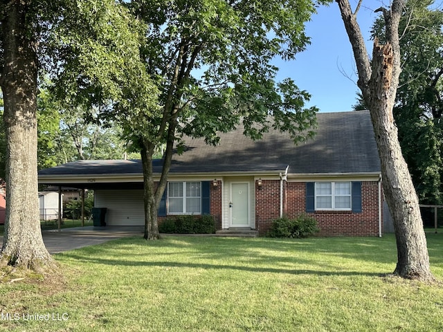 1529 Ticonderoga Dr, Southaven, MS 38671 - view of front of house featuring brick siding, a front lawn, an attached carport, driveway, and a shingled roof