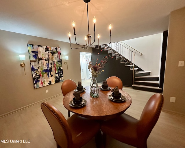 1529 Ticonderoga Dr, Southaven, MS 38671 - dining room with stairs, a chandelier, and baseboards