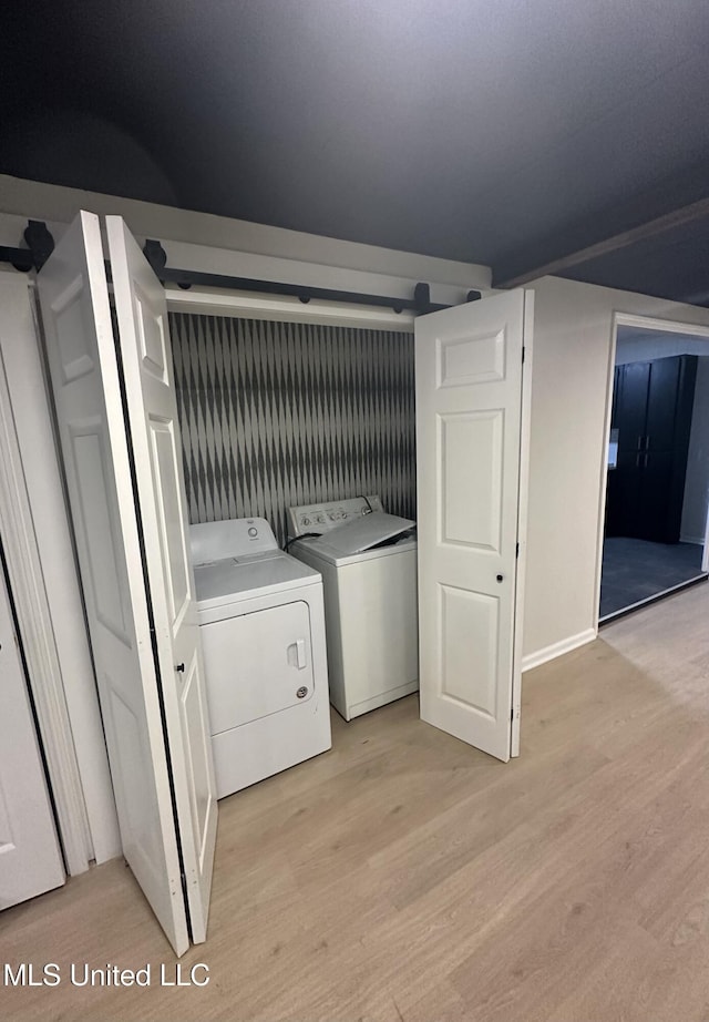 1529 Ticonderoga Dr, Southaven, MS 38671 - laundry area with light wood-style flooring and separate washer and dryer